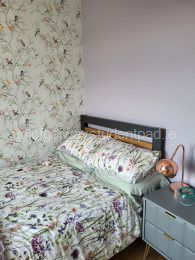 Comfortable double bed and nightstand