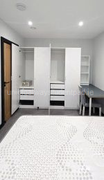 Main bedroom, two double wardrobes with drawers, desk, chair, bedside locker and shelf unit on desk.